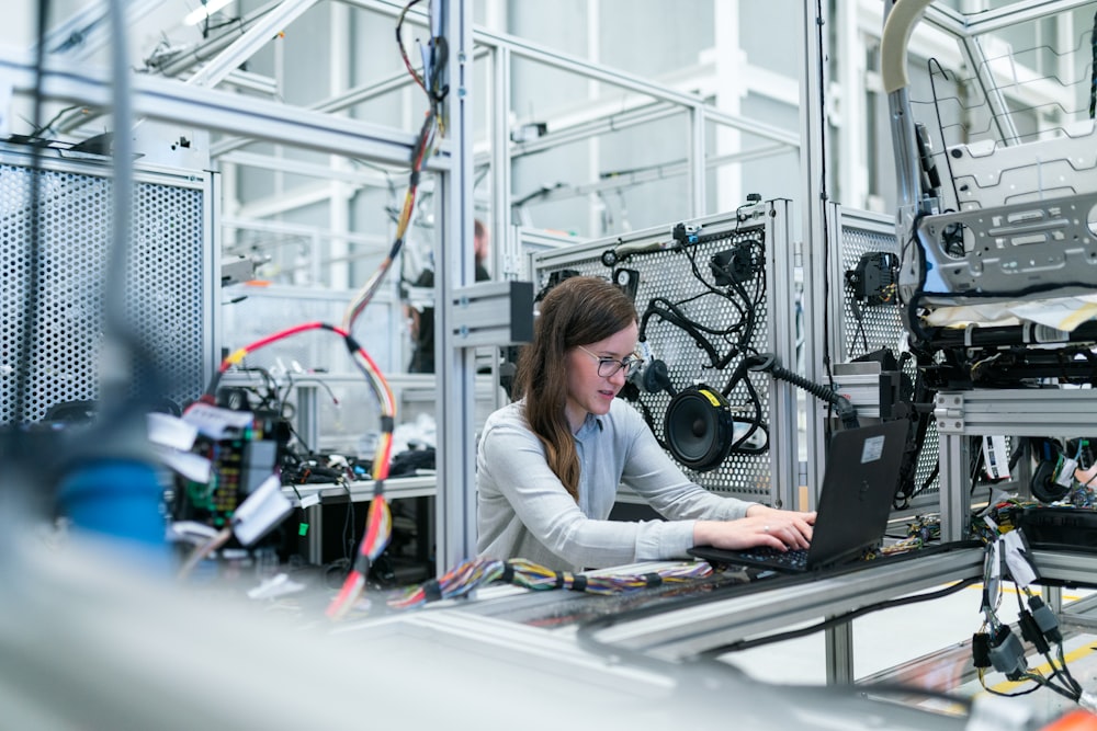 Engineer connecting industrial equipment on the factory floor